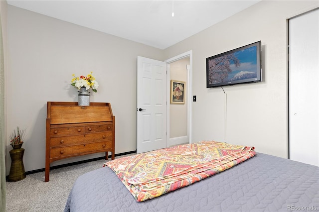 bedroom featuring carpet flooring and baseboards