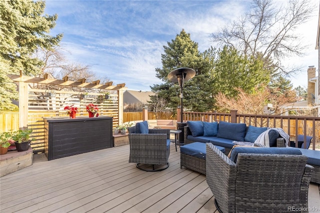 wooden terrace with fence and an outdoor hangout area