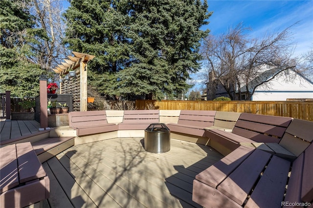 wooden terrace featuring fence