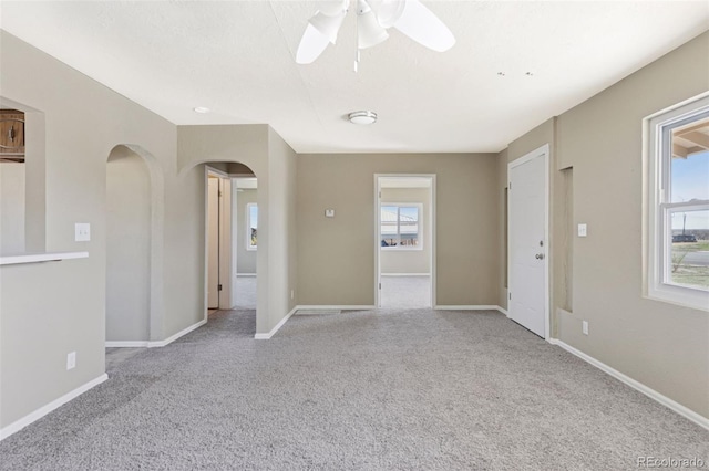 448 K Ave, Limon, CO 80828 - carpeted spare room featuring arched walkways, a ceiling fan, and baseboards