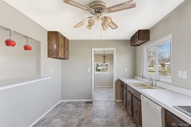 448 K Ave, Limon, CO 80828 - kitchen featuring white dishwasher, a sink, a ceiling fan, and light countertops