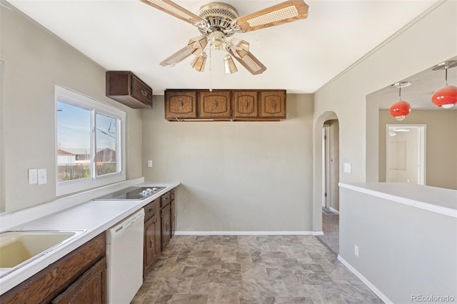 448 K Ave, Limon, CO 80828 - kitchen with white dishwasher, ceiling fan, arched walkways, black electric cooktop, and light countertops