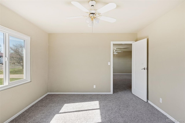 448 K Ave, Limon, CO 80828 - unfurnished room with carpet flooring, healthy amount of natural light, ceiling fan, and baseboards