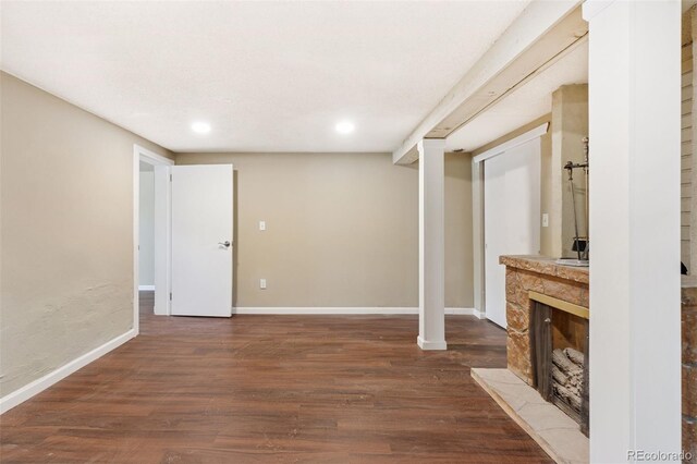 448 K Ave, Limon, CO 80828 - unfurnished living room with dark wood-style flooring, recessed lighting, baseboards, and a fireplace