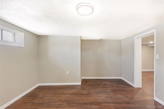 448 K Ave, Limon, CO 80828 - empty room featuring wood finished floors, a textured ceiling, and baseboards