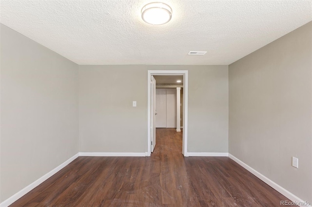 448 K Ave, Limon, CO 80828 - spare room with wood finished floors, baseboards, and a textured ceiling