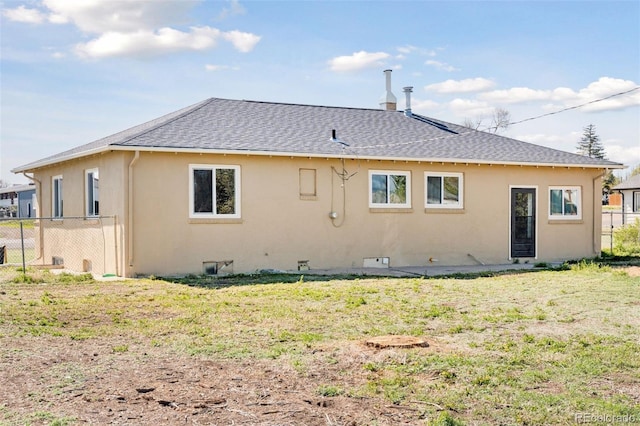 448 K Ave, Limon, CO 80828 - back of house featuring a shingled roof and stucco siding