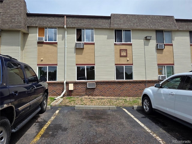 9650 Huron St Unit 3, Thornton, CO 80260 - view of property featuring uncovered parking