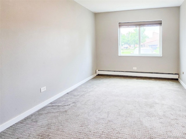 9650 Huron St Unit 3, Thornton, CO 80260 - spare room featuring carpet flooring and a baseboard heating unit
