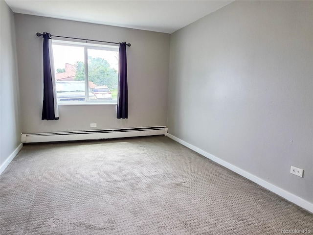 9650 Huron St Unit 3, Thornton, CO 80260 - carpeted spare room featuring a baseboard radiator and baseboards