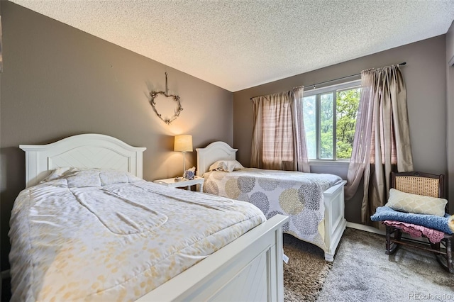 2238 S Nome Ct, Aurora, CO 80014 - bedroom featuring carpet flooring, a textured ceiling, and vaulted ceiling