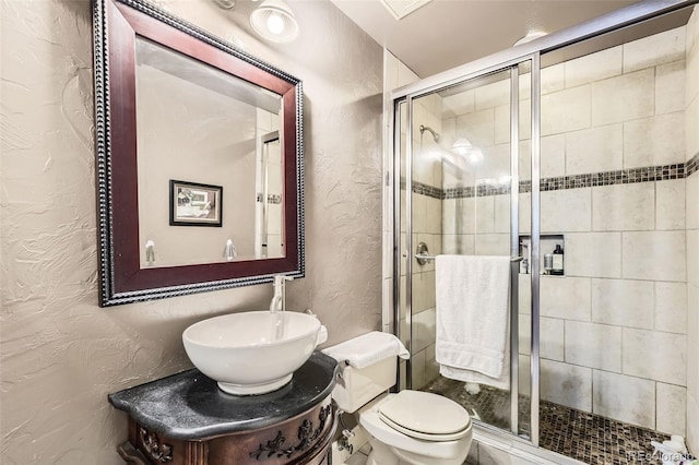 2238 S Nome Ct, Aurora, CO 80014 - full bath with a textured wall, a shower stall, and vanity