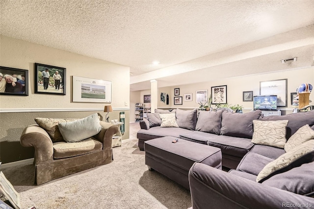2238 S Nome Ct, Aurora, CO 80014 - carpeted living area featuring a textured ceiling and ornate columns