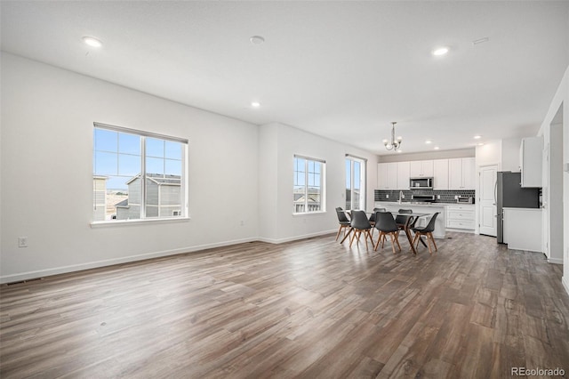 dining room featuring a notable chandelier and hardwood / wood-style floors