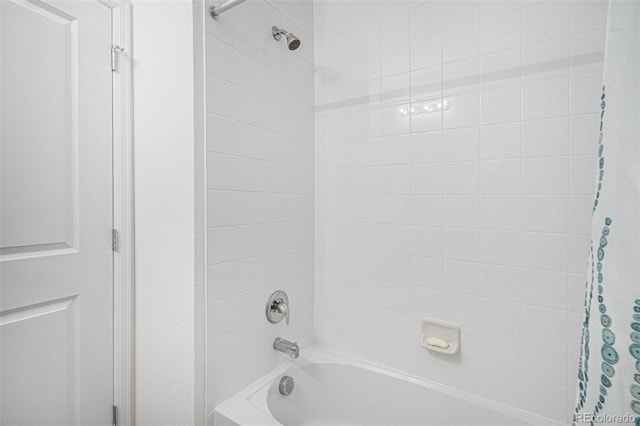 bathroom featuring shower / bathtub combination with curtain