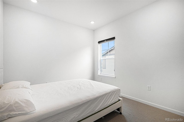 bedroom with recessed lighting, carpet floors, and baseboards
