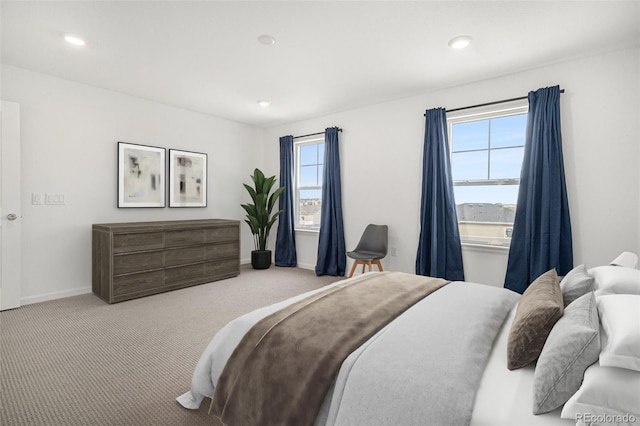 carpeted bedroom with recessed lighting and baseboards