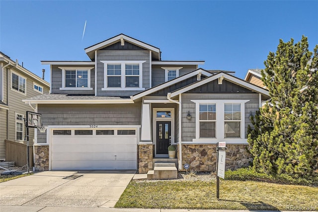 3024 Woodbriar Dr, Highlands Ranch, CO 80126 - view of front facade with stone siding, driveway, a garage, and board and batten siding