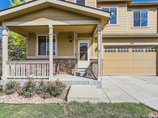 view of front of property featuring a garage and covered porch