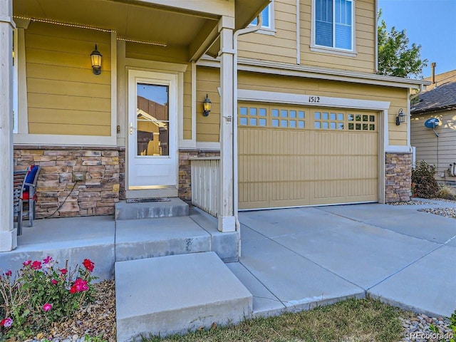 entrance to property featuring a garage