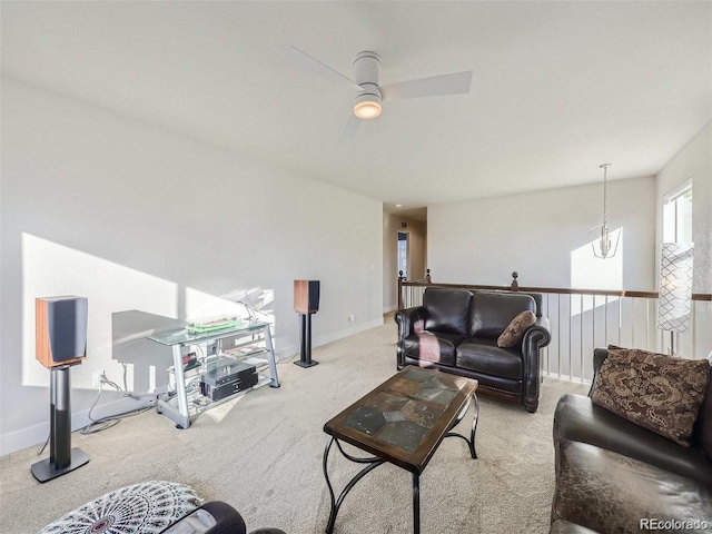 living room featuring light carpet and ceiling fan