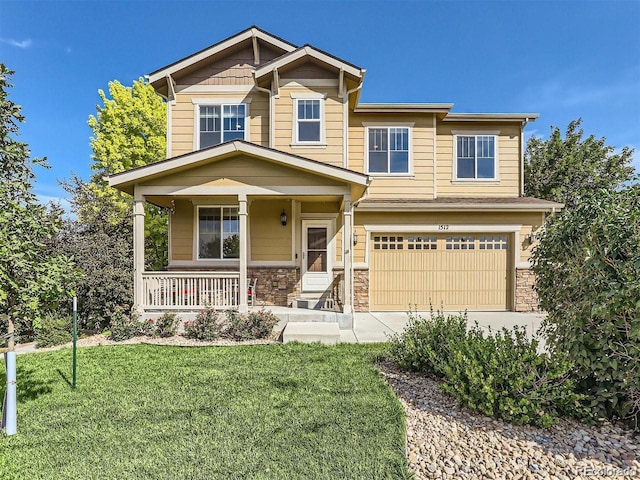 craftsman-style home featuring a garage, a porch, and a front yard