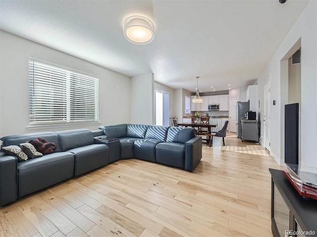 living room with light hardwood / wood-style floors