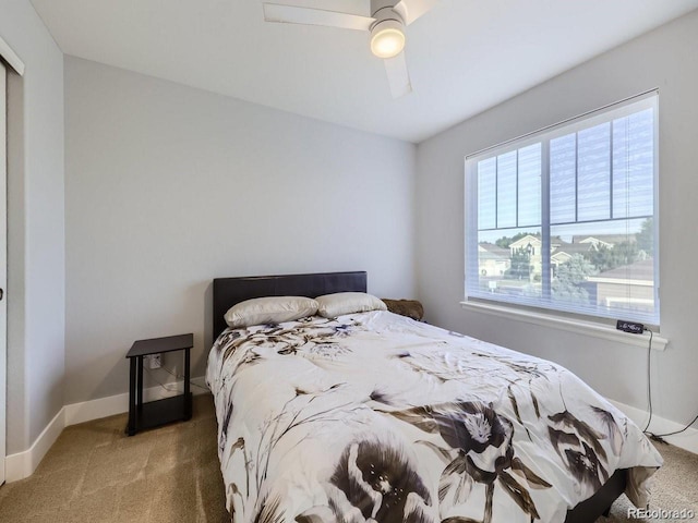 carpeted bedroom featuring ceiling fan