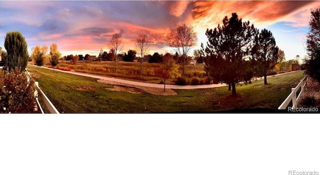 yard at dusk with a rural view