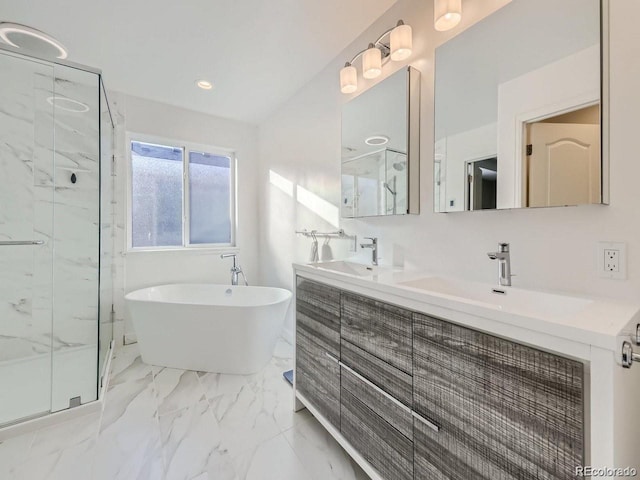 bathroom with shower with separate bathtub and vanity