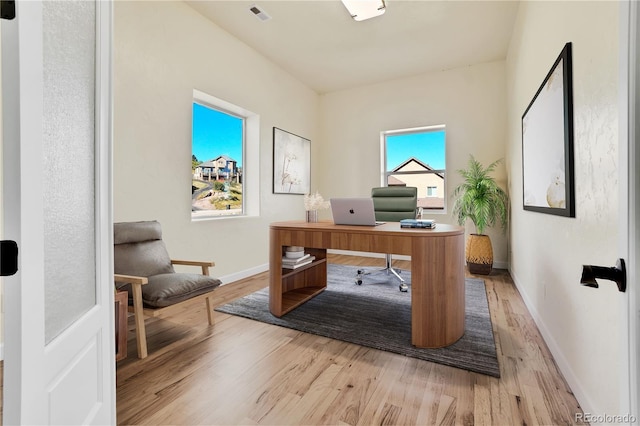 office space with light hardwood / wood-style flooring