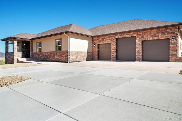 prairie-style home featuring a garage