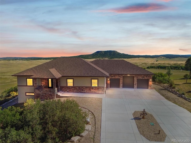 view of front of house featuring a mountain view and a garage