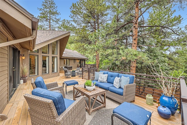 4856 Cheyenne Dr, Larkspur, CO 80118 - wooden deck with an outdoor hangout area