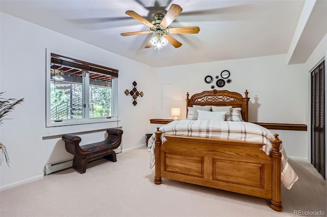 4856 Cheyenne Dr, Larkspur, CO 80118 - bedroom featuring light colored carpet, a closet, a baseboard heating unit, baseboards, and ceiling fan