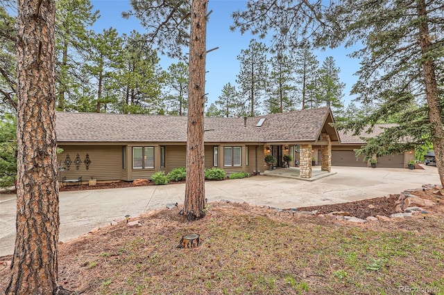 4856 Cheyenne Dr, Larkspur, CO 80118 - ranch-style house featuring concrete driveway and a shingled roof