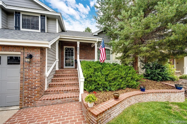 9846 Spring Hill Ln, Highlands Ranch, CO 80129 - property entrance with a garage and brick siding