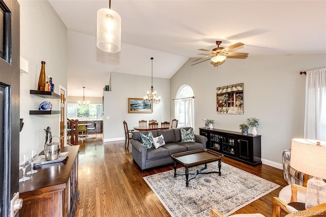 9846 Spring Hill Ln, Highlands Ranch, CO 80129 - living room featuring a chandelier, ceiling fan, dark wood-style floors, and high vaulted ceiling