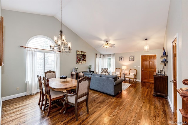 9846 Spring Hill Ln, Highlands Ranch, CO 80129 - dining area featuring lofted ceiling, dark wood-style flooring, a chandelier, and a ceiling fan