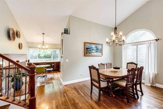 9846 Spring Hill Ln, Highlands Ranch, CO 80129 - dining area featuring a chandelier, wood finished floors, high vaulted ceiling, healthy amount of natural light, and stairs