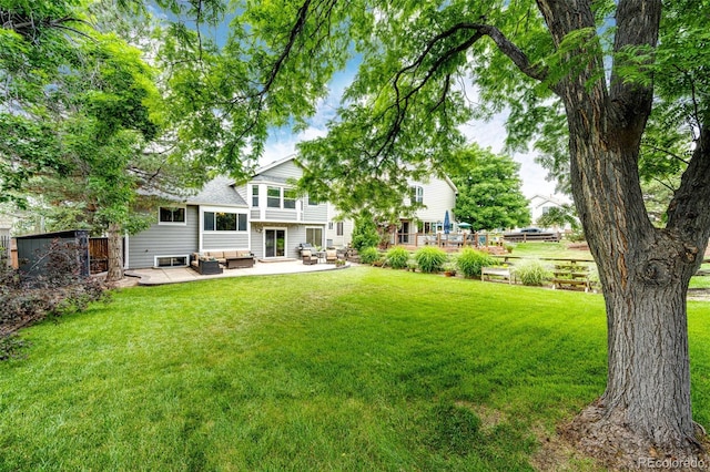 9846 Spring Hill Ln, Highlands Ranch, CO 80129 - view of green lawn with an outdoor living space and a patio