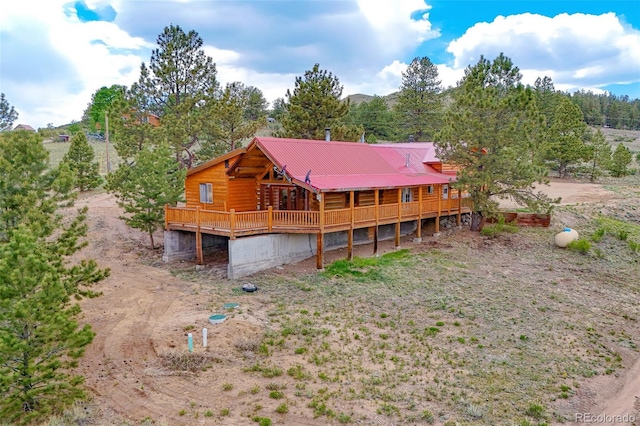 780 Oak St, Hartsel, CO 80449 - back of property with a wooden deck and a metal roof