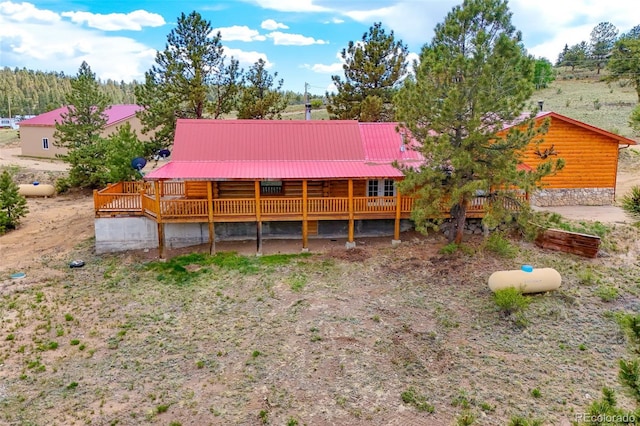 780 Oak St, Hartsel, CO 80449 - rear view of house featuring a wooden deck, a metal roof, and log exterior