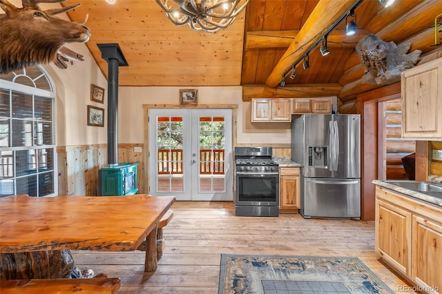 780 Oak St, Hartsel, CO 80449 - kitchen with appliances with stainless steel finishes, wood ceiling, a wood stove, rail lighting, and french doors