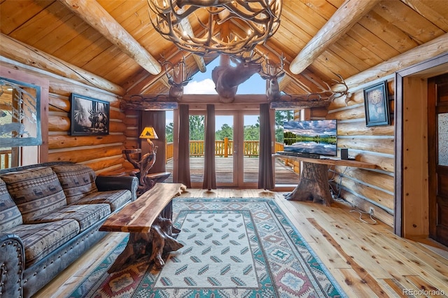 780 Oak St, Hartsel, CO 80449 - living room featuring log walls, wooden ceiling, a chandelier, and hardwood / wood-style flooring