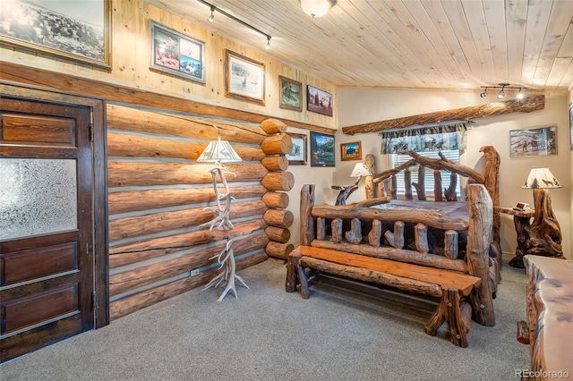 780 Oak St, Hartsel, CO 80449 - carpeted bedroom with track lighting, log walls, wooden ceiling, and lofted ceiling