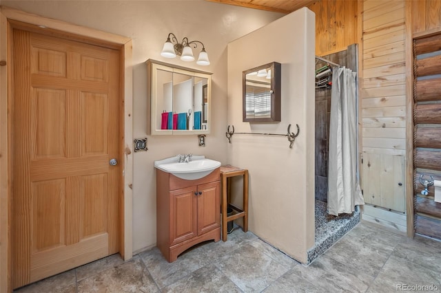 780 Oak St, Hartsel, CO 80449 - bathroom featuring vanity, a shower stall, and stone finish flooring