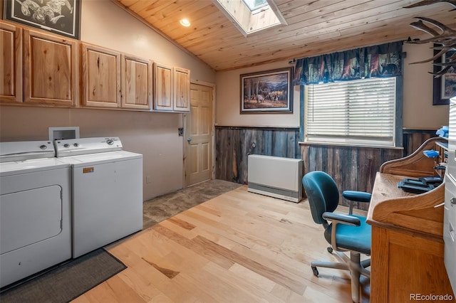 780 Oak St, Hartsel, CO 80449 - laundry room featuring washer and clothes dryer, a wainscoted wall, light wood finished floors, a skylight, and wood ceiling