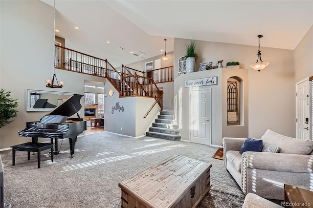 carpeted living room featuring a high ceiling