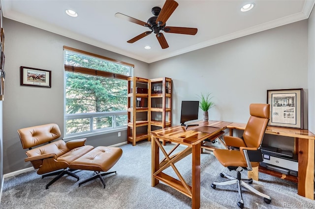 carpeted office space with ceiling fan and ornamental molding